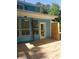 Rear deck with multiple windows to the home with a small privacy fence at right at 1041 Kennesborough Nw Rd, Kennesaw, GA 30144