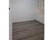 Dining area features gray wood-look floors, white walls, and white cabinets at 1041 Kennesborough Nw Rd, Kennesaw, GA 30144