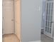 Hallway with two doors, one to the bedroom closet and one to the main room at 1041 Kennesborough Nw Rd, Kennesaw, GA 30144