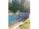 Community pool enclosed by black iron fence with lounge chairs nearby for relaxing at 1041 Kennesborough Nw Rd, Kennesaw, GA 30144