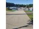 Community skatepark featuring concrete ramps, rails, and a smooth riding surface at 1041 Kennesborough Nw Rd, Kennesaw, GA 30144