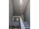 Staircase design with railing and chandelier at 1041 Kennesborough Nw Rd, Kennesaw, GA 30144