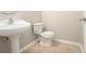 Clean bathroom with pedestal sink and toilet at 4010 Village Run Dr, Mcdonough, GA 30252