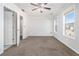 Bright bedroom with carpet, ceiling fan, and access to bathroom at 4010 Village Run Dr, Mcdonough, GA 30252
