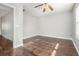 Spacious bedroom featuring wood flooring and ceiling fan at 4010 Village Run Dr, Mcdonough, GA 30252