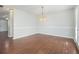 Simple dining room with hardwood floors and chandelier at 4010 Village Run Dr, Mcdonough, GA 30252
