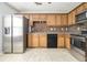 Kitchen with stainless steel appliances and wood cabinets at 4010 Village Run Dr, Mcdonough, GA 30252