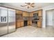 Kitchen with stainless steel appliances and wood cabinets at 4010 Village Run Dr, Mcdonough, GA 30252