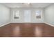Bright living room with hardwood floors and neutral walls at 4010 Village Run Dr, Mcdonough, GA 30252