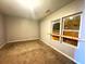 A third bedroom with new carpeting and window at 781 Peyton Nw Ave, Atlanta, GA 30318