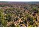 Overhead view showcases home nestled in a lush, mature wooded area at 2493 Oldfield Nw Rd, Atlanta, GA 30327