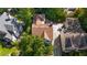 An aerial view of a home with a driveway and mature trees providing shade and privacy at 2493 Oldfield Nw Rd, Atlanta, GA 30327