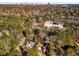 An aerial view shows the property nestled amongst lush landscaping with views of the city at 2493 Oldfield Nw Rd, Atlanta, GA 30327