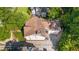 An aerial view shows a well-maintained home with manicured landscaping and a two-car garage at 2493 Oldfield Nw Rd, Atlanta, GA 30327