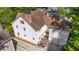 Aerial view of the backyard with garage, patio, and outdoor seating area at 2493 Oldfield Nw Rd, Atlanta, GA 30327