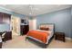 Bedroom with blue walls, ceiling fan, carpet flooring, and an ensuite entrance at 2493 Oldfield Nw Rd, Atlanta, GA 30327