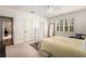 Bedroom with neutral walls, carpet flooring, ceiling fan, and a view to the ensuite bathroom at 2493 Oldfield Nw Rd, Atlanta, GA 30327