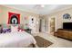 Spacious bedroom showcasing a view of the bathroom, neutral tones and ceiling fan at 2493 Oldfield Nw Rd, Atlanta, GA 30327