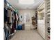 A large walk-in closet with custom shelving and storage providing ample space for clothes, shoes, and accessories at 2493 Oldfield Nw Rd, Atlanta, GA 30327