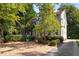 Beautiful home featuring manicured landscaping, shingle siding and gravel driveway at 2493 Oldfield Nw Rd, Atlanta, GA 30327