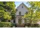 Stately home with shingle siding, a green front door, and well-maintained landscaping at 2493 Oldfield Nw Rd, Atlanta, GA 30327