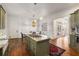 Spacious kitchen features an island gas cooktop, a dining nook and neutral color palette at 2493 Oldfield Nw Rd, Atlanta, GA 30327