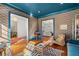 View of hardwood floors and zebra rug inside this sophisticated living room with a pop of color at 2493 Oldfield Nw Rd, Atlanta, GA 30327