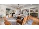 An open living room layout featuring hardwood floors, a neutral sofa, and a view into other rooms of the house at 2493 Oldfield Nw Rd, Atlanta, GA 30327