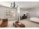 Bright bedroom featuring neutral walls, ceiling fan, and large windows with white shutters at 2493 Oldfield Nw Rd, Atlanta, GA 30327