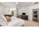 Spacious bedroom with ceiling fan, neutral walls, shuttered window, and an ensuite entrance at 2493 Oldfield Nw Rd, Atlanta, GA 30327