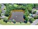 Aerial view of homes surrounding a peaceful neighborhood pond at 3550 Rivers End Pl, Buford, GA 30519