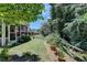 Landscaped backyard with lush greenery and wooden fence at 3550 Rivers End Pl, Buford, GA 30519