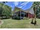Brick house with screened porch and landscaped yard at 3550 Rivers End Pl, Buford, GA 30519
