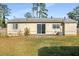 Ranch home with a spacious backyard and patio at 158 Ashwood Ct, Riverdale, GA 30274