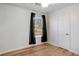 Light and airy bedroom with wood floors at 158 Ashwood Ct, Riverdale, GA 30274