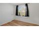 Bedroom with wood floors and window at 158 Ashwood Ct, Riverdale, GA 30274