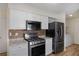 Modern kitchen with stainless steel appliances and granite countertops at 158 Ashwood Ct, Riverdale, GA 30274