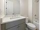 Well-lit bathroom includes tiled shower/tub, white cabinets, and white countertops at 4455 Ryker Rd, Cumming, GA 30041