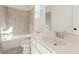 Bathroom with a tub, tiled shower, and a white vanity with a modern chrome faucet at 4455 Ryker Rd, Cumming, GA 30041