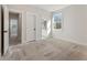 Spacious bedroom with bright natural light and doorway to the attached bathroom at 4455 Ryker Rd, Cumming, GA 30041