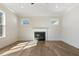 Spacious living room boasts fireplace, hardwood floors and natural light at 4455 Ryker Rd, Cumming, GA 30041
