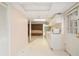 Small basement kitchenette with white cabinets and appliances at 201 Vistawood Ln, Marietta, GA 30066