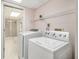 Basement laundry room with washer, dryer, and shelving at 201 Vistawood Ln, Marietta, GA 30066
