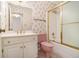 Pink bathroom with shower/tub combo and floral wallpaper at 201 Vistawood Ln, Marietta, GA 30066