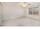 Spacious bedroom with ceiling fan, carpet, and window at 201 Vistawood Ln, Marietta, GA 30066