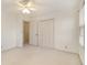 Bedroom with double door closet and ceiling fan at 201 Vistawood Ln, Marietta, GA 30066