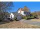 White two-story house with a large backyard and attached garage at 201 Vistawood Ln, Marietta, GA 30066