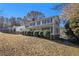 Two-story house with a brick chimney and attached garage, situated on a grassy lot at 201 Vistawood Ln, Marietta, GA 30066