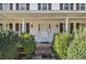 Classic front porch entry with brick steps and lush green shrubs at 201 Vistawood Ln, Marietta, GA 30066