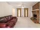 Spacious living room featuring a brick fireplace and a large window at 201 Vistawood Ln, Marietta, GA 30066